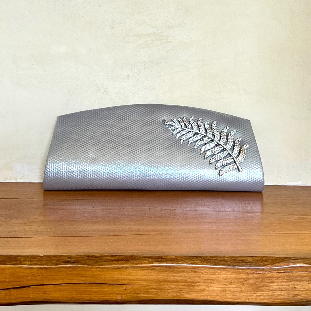 Silver clutch with diamond encrusted leaves